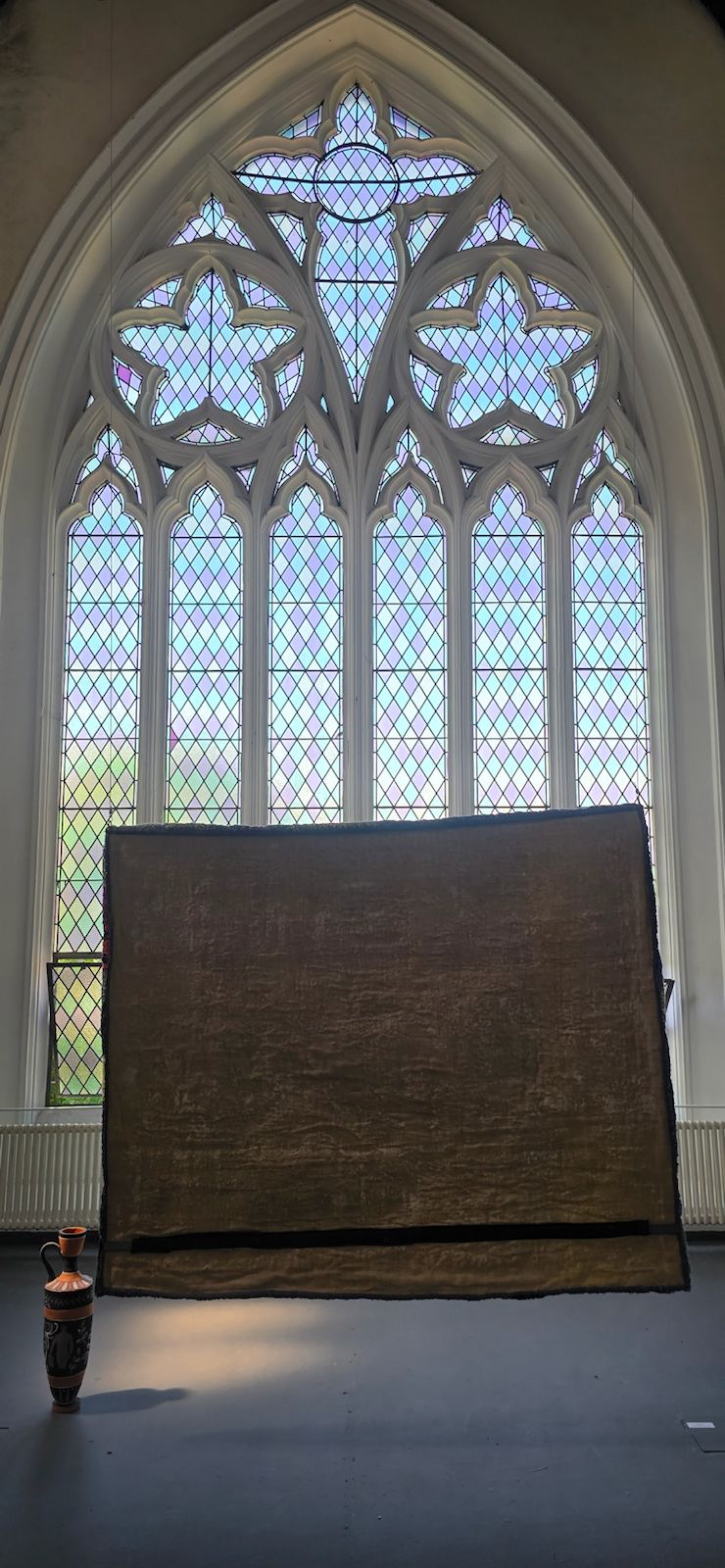 Rear installation view, the tufted textile facing the church window